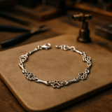 Bracciale con Charms a Forma di Zampa e Osso d'Argento