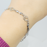 Bracciale con Charms a Forma di Zampa e Osso d'Argento