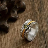 Anello in Argento Martellato con Oro e Peridoto