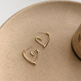 Orecchini Funky a Forma di Cuore in Oro e Argento
