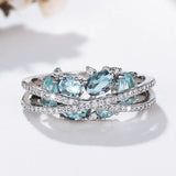 Anello con croce in argento e pietra preziosa blu