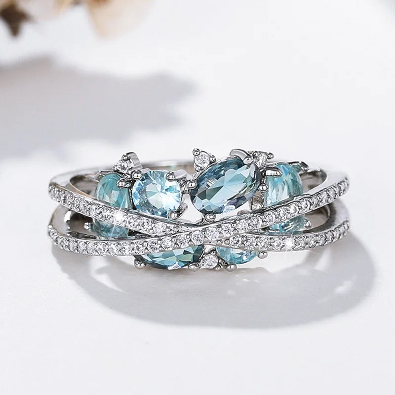 Anello con croce in argento e pietra preziosa blu